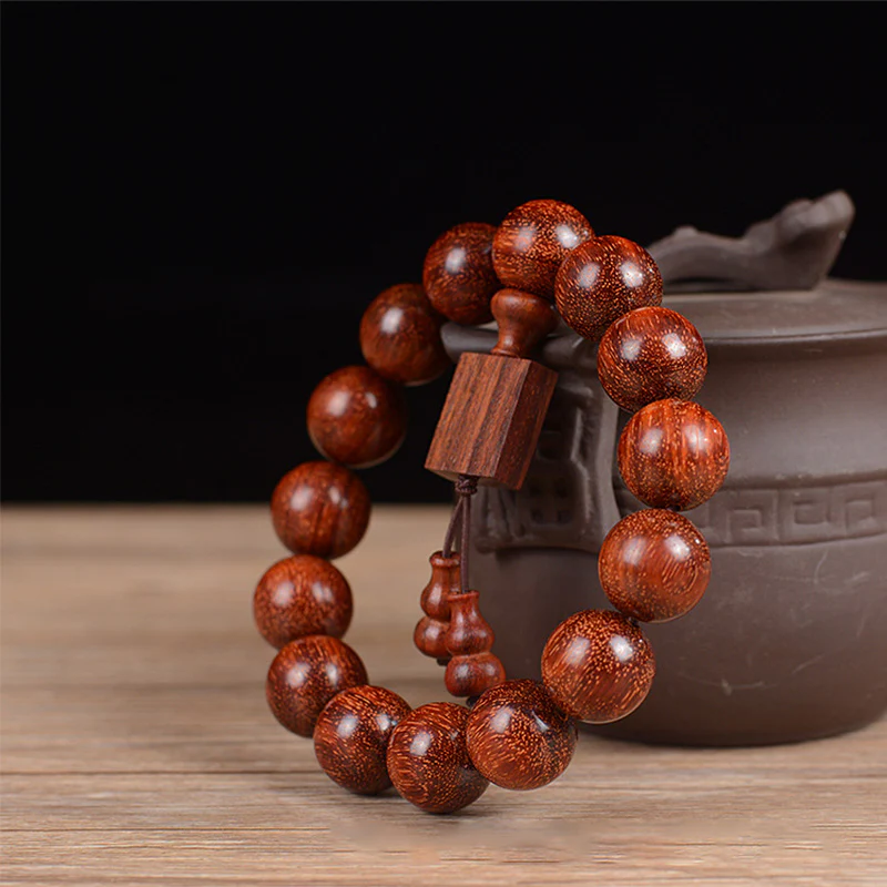 Braccialetto di rilassamento in legno di sandalo rosso con foglie piccole tibetane Buddha Stones - Image 7